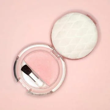 Brush and compact powder, elevated view Stock Photos