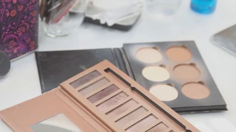 Brush and eye shadow makeup tools on the table Video stock 69924835