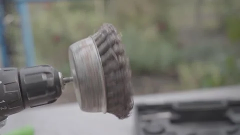 A brush is attached to a drill bit Stock Footage 303294054