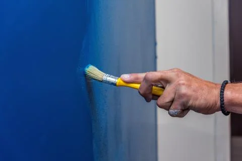 Brush with blue paint Stock Photos