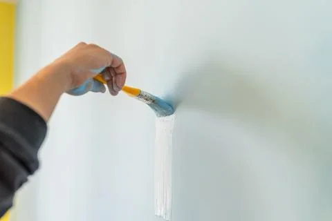 Brush with blue paint. Stock Photos