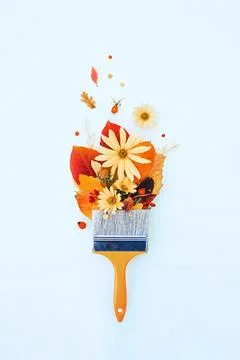 Brush, bright multi-colored autumn leaves and flowers on a blue background Stock Photos