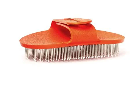 Brush for combing long-haired animals, isolated on white background. Stock-Fotos