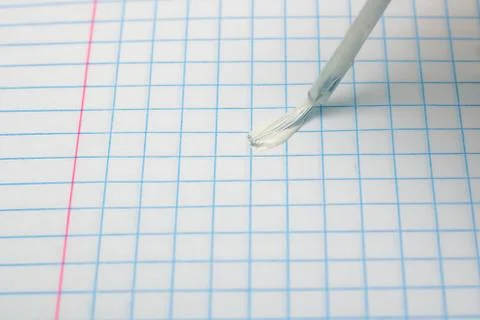 Brush to correct errors on a sheet of notebook 스톡 사진
