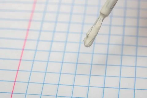 Brush to correct errors on a sheet of notebook 스톡 사진