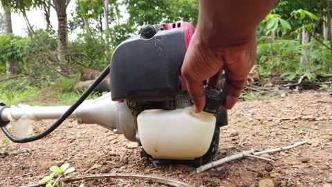 Brush cutter machine refueling. Stock Footage 161173638