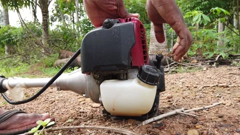 Brush cutter machine starting process Stock Footage 161173423