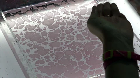 Brush drawing with colored inks on water Stock Footage 42556315