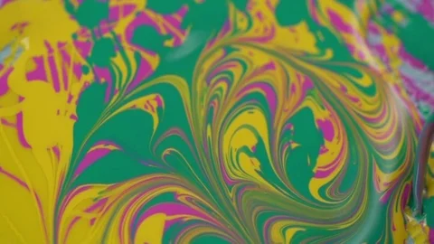 The brush draws patterns on a mixture of glossy varnishes. Video stock 77554234