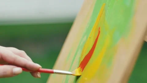 Brush draws red curl Stock Footage 181068940