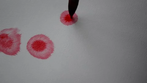 Brush with drops of red paint and stains on white paper Video stock 167635057