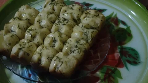 Brush the garlic bread with margarine Stock Footage 287424453