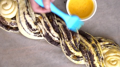 The brush greasing the roll with a yolk Stock Footage 88695958