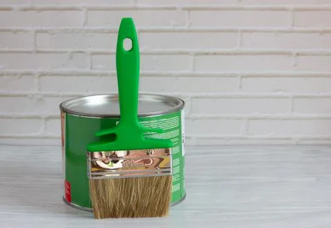Brush with green paint on a light background. renovation concept Stock Photos