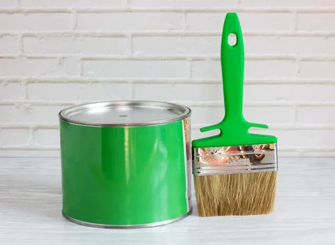 Brush with green paint on a light background. renovation concept Stock Photos