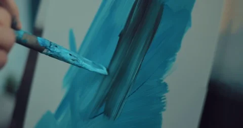 Brush in hand make strokes of paint on paper. Close-up. Stock Footage 104576858