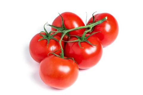 A brush of large tomatoes on a white background. Studio photo, isolate, tom.. 스톡 사진