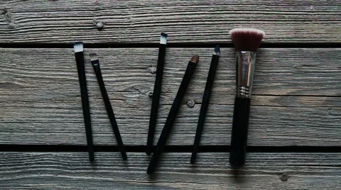 Brush make-up on the table. Makeup artist takes the brush Video stock 68902233