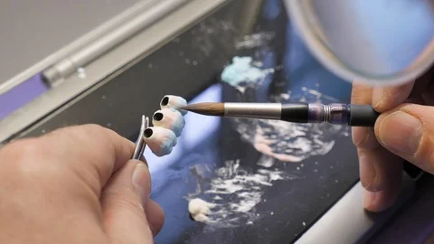 Brush model of dental prosthetics  Stock Footage 99892738