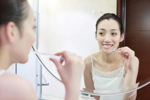 Brush Oriental figures Get ready. Adult Portrait Brush your teeth Health Women Stock Photos