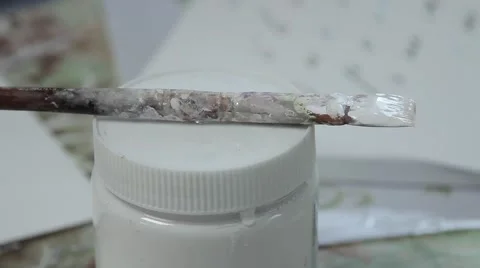 Brush in the paint against the backdrop of the stencil Stock-Footage 66910996