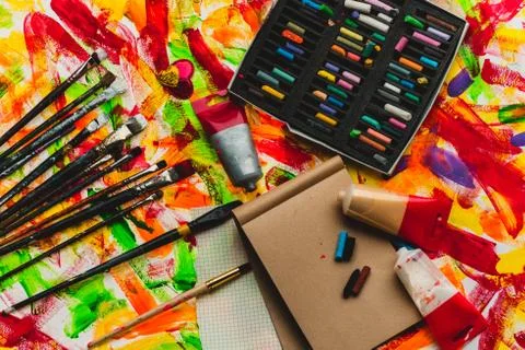 Brush palette, tools for creative work on abstract artistic background Stock Photos