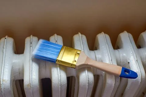 Brush on a radiator Stock Photos
