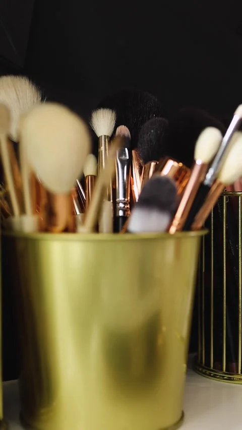 Brush set for make-up on table. Makeup artist tools. Stock Footage 270359498