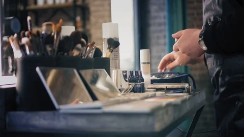 Brush sets and shadow palettes for make-up on the table in beauty salon Stock Footage 86711178