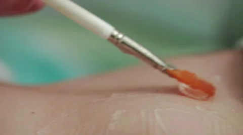 With a brush spread the gel skin. close-up Stock Footage 47731900