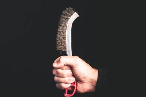 Brush - tools in a man hand - maintenance service concept Stock Photos