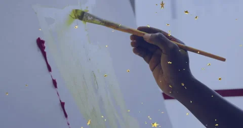 On brush touching canvas, artist layering green marks for watercolor wash as Stock Footage 311962034