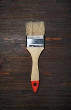 Brush on wood table Stock Photos