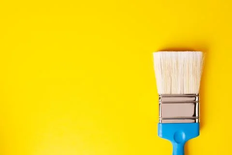 Brush on a yellow background, copy paste, right orientation. Stock Photos