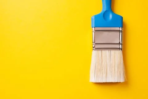 Brush on a yellow background, copy paste. Stock-Fotos