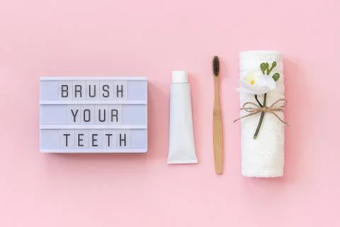 Brush your teeth - Light box text and natural eco-friendly bamboo brush for t Stock Photos