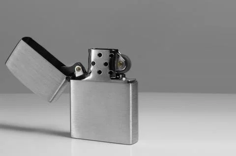 Brushed chrome lighter with windproof. close-up Stock Photos