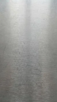 Brushed metal texture background with horizontal scratches and subtle refle.. Stock Photos