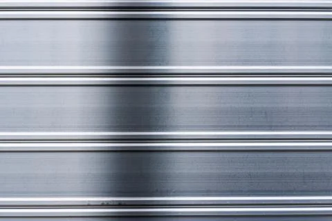 Brushed silver metal surface with horizontal stripes texture Stock Photos