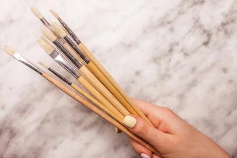 Brushers in female hand Stock Photos