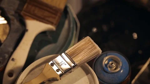 Brushes and Cans with Paint and Jars with Solvent in the Artist's Studio. Видео 82382559
