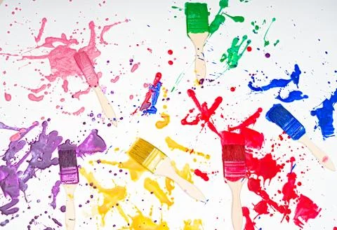 Brushes and paint , different colors , wall painting , rainbow colors Stock Photos