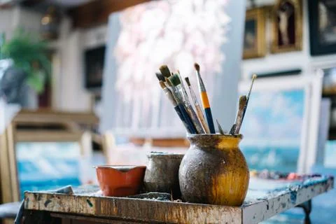 Brushes in art workshop Stock Photos