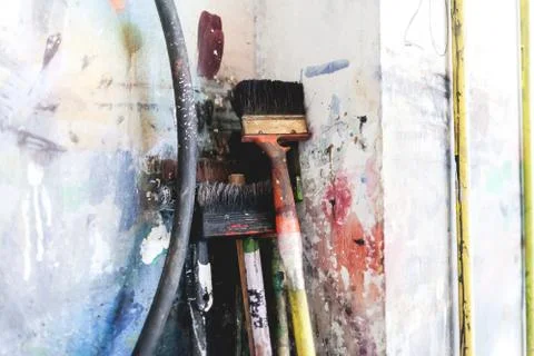 Brushes of the big size in an art workshop Stock Photos