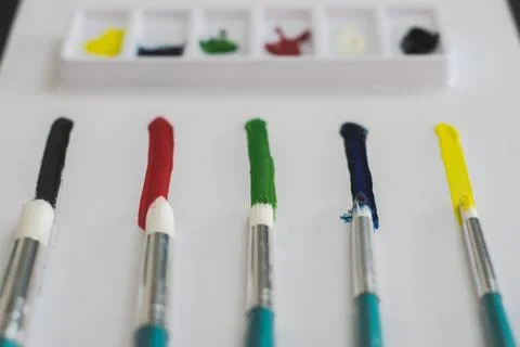 Brushes with a line of different colors Stock Photos