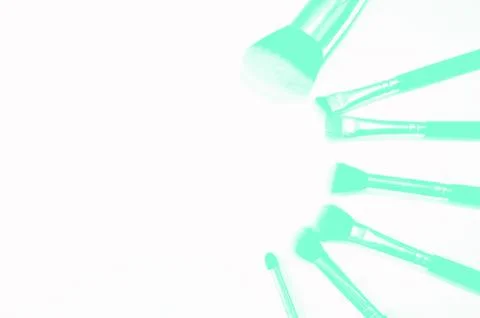 Brushes for makeup lying on white background. Aqua Menthe Stock Photos
