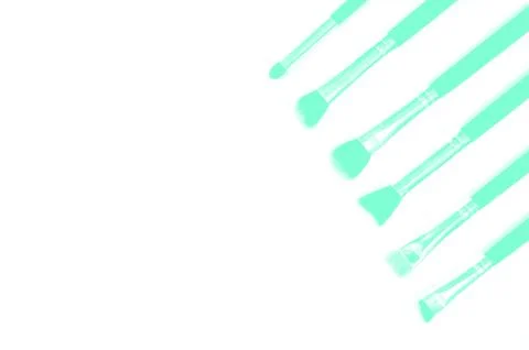 Brushes for makeup lying on white background. Aqua Menthe Stock Photos