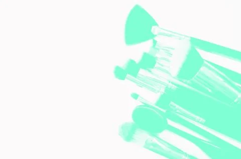 Brushes for makeup lying on white background. Aqua Menthe Stock Photos