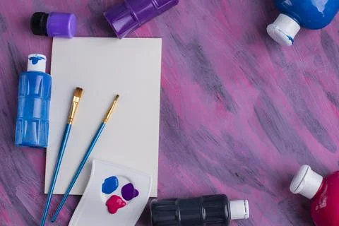 Brushes, paint cans, and an empty notepad Stock Photos