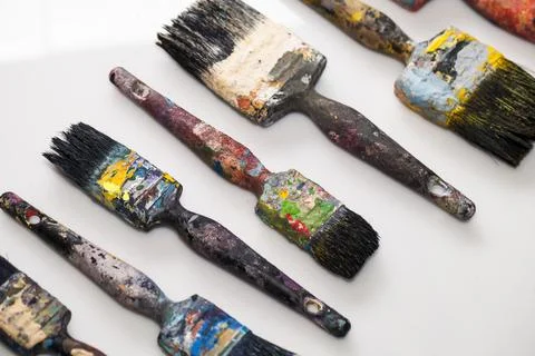 Brushes in paints on a white background 写真素材